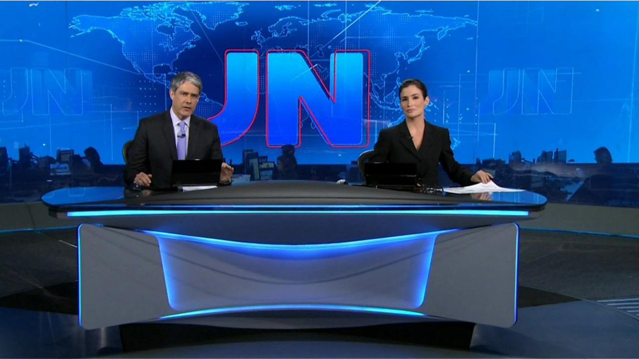 Cena de reportagem: jornal Nacional - TheTVDB.com, no trecho “Selos feitos à mão e a primeira abertura em computação gráfica”