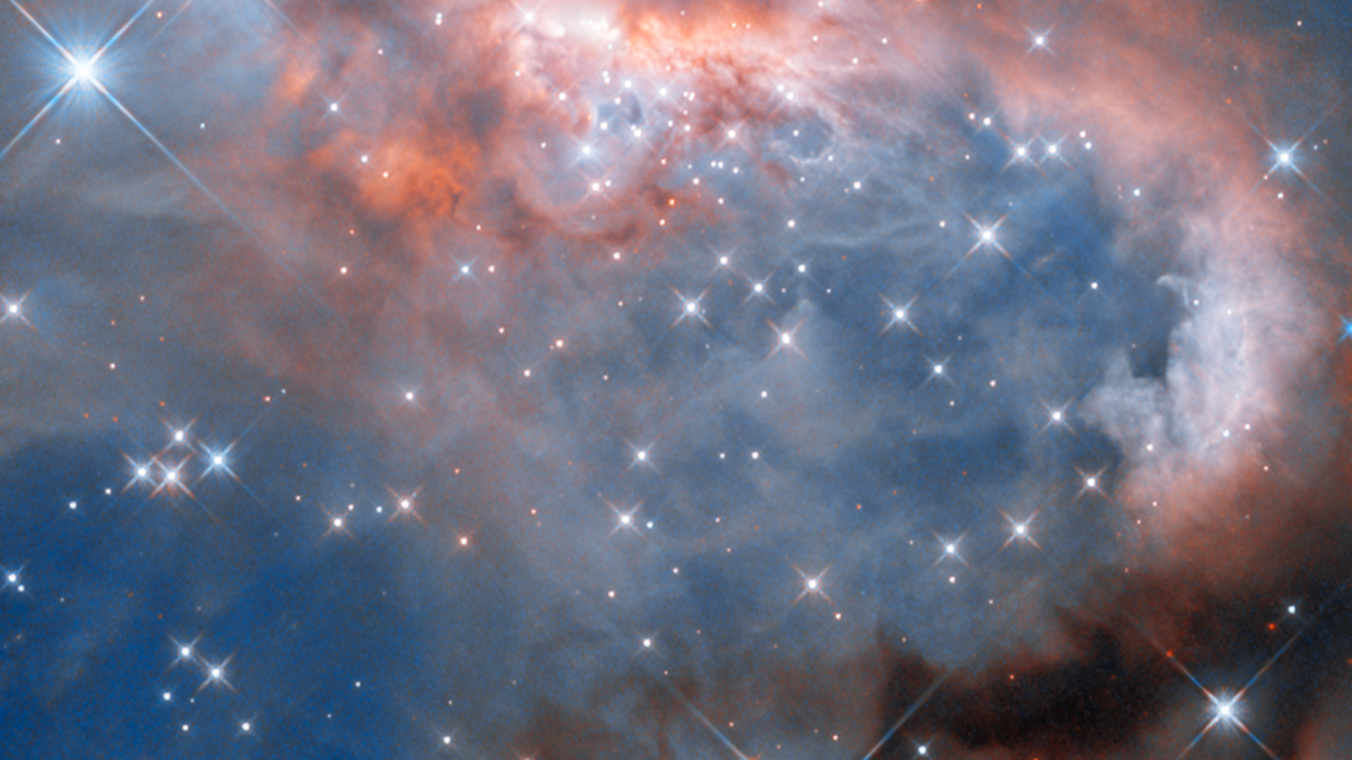 Cena de reportagem: hubble captures newborn stars in stunning image Chalmers, no trecho “O que se vê na imagem”